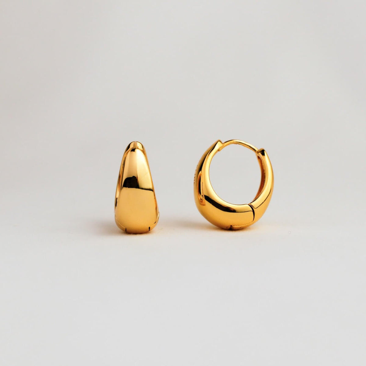 Vettona earrings on a gray background
