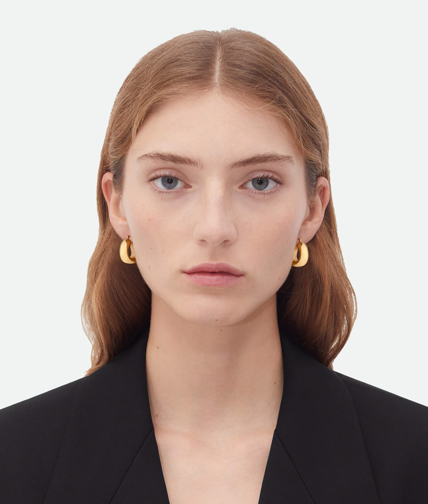 Model wearing Chunky Gold Hoop Earrings