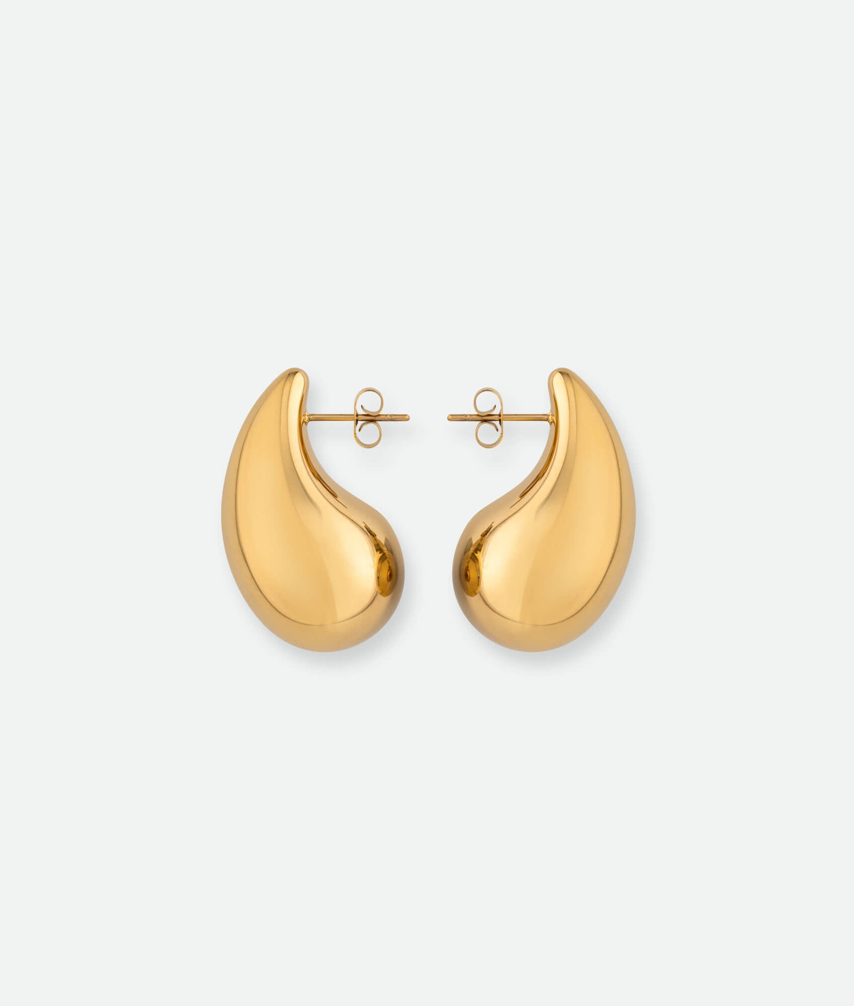 Gold hoop earrings on a white background