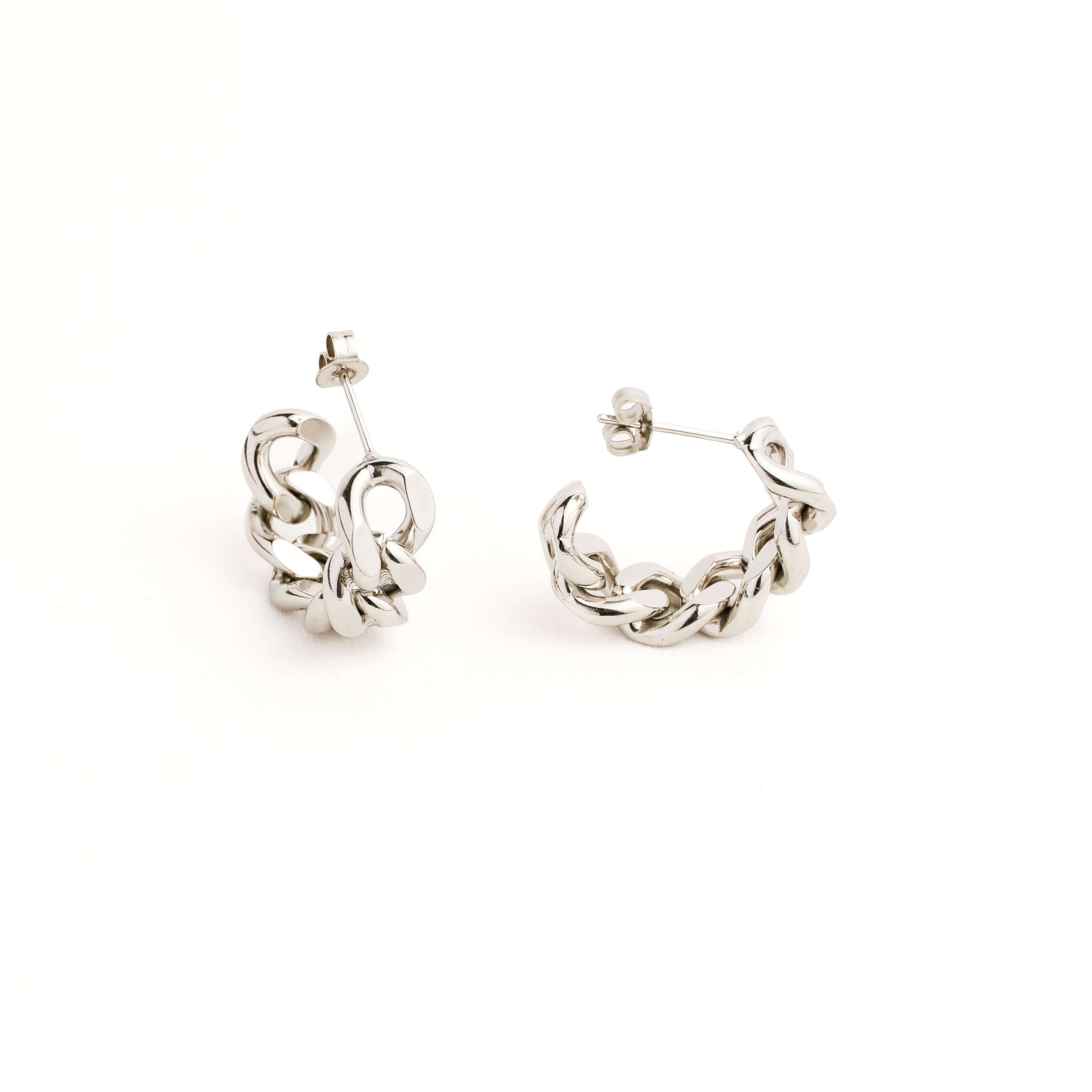 Pair of silver chain hoop earrings on a white background
