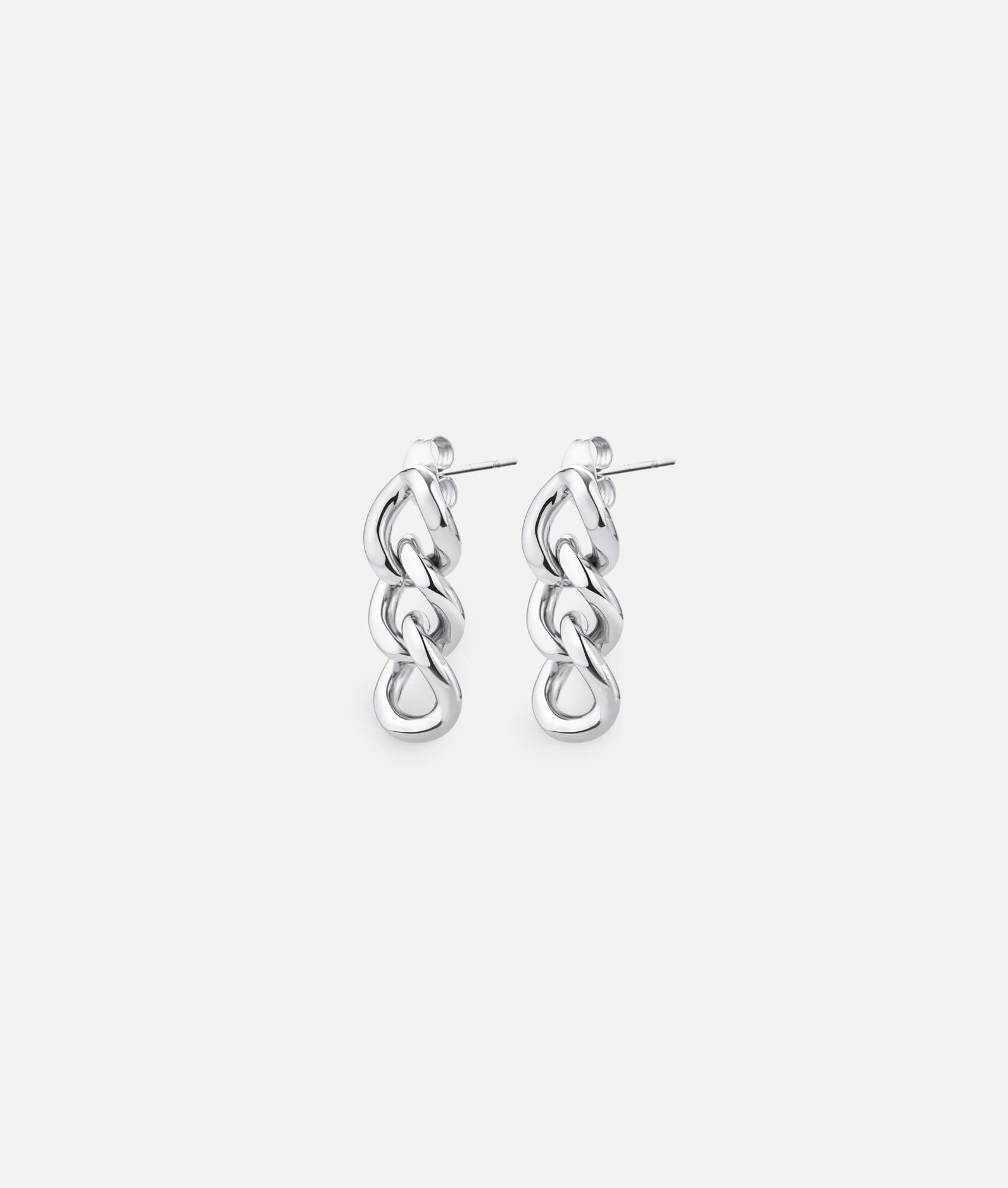 Pair of silver chain link earrings on a white background