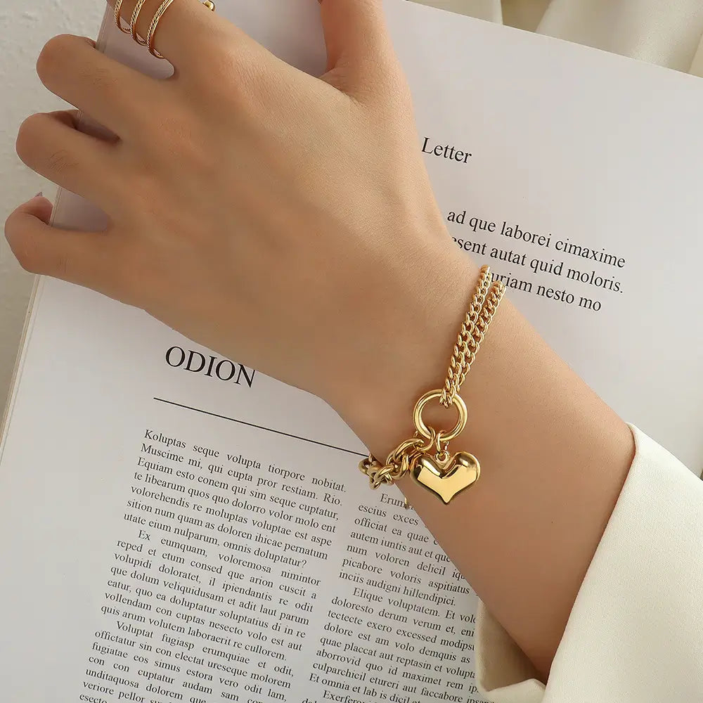 A Women wearing Gold Love Heart Bracelet