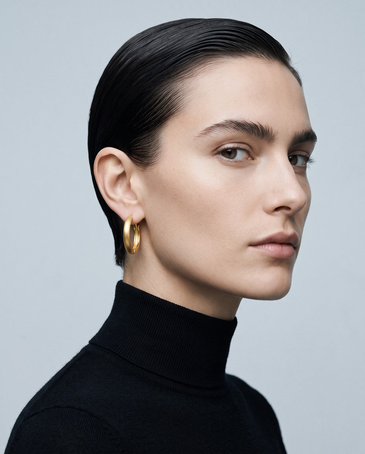 Slate Matte Huggie Earrings – editorial campaign image