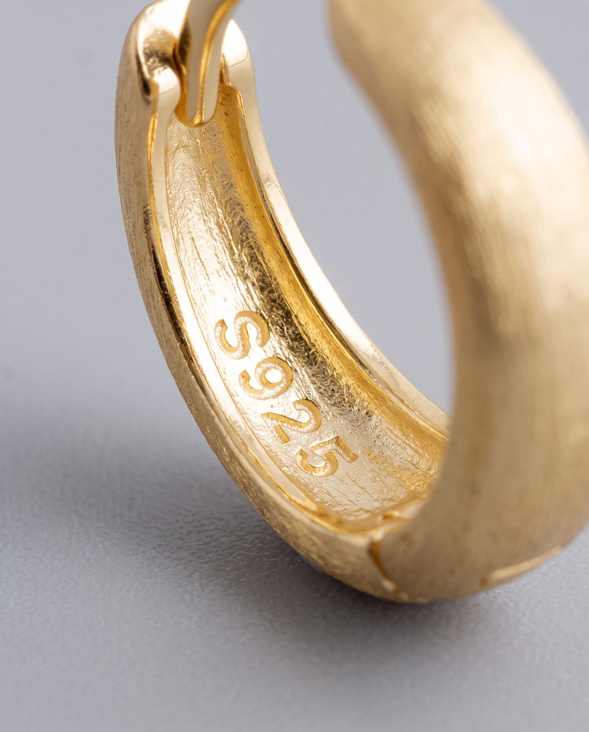 Sleek Wide Huggie Earrings - detail