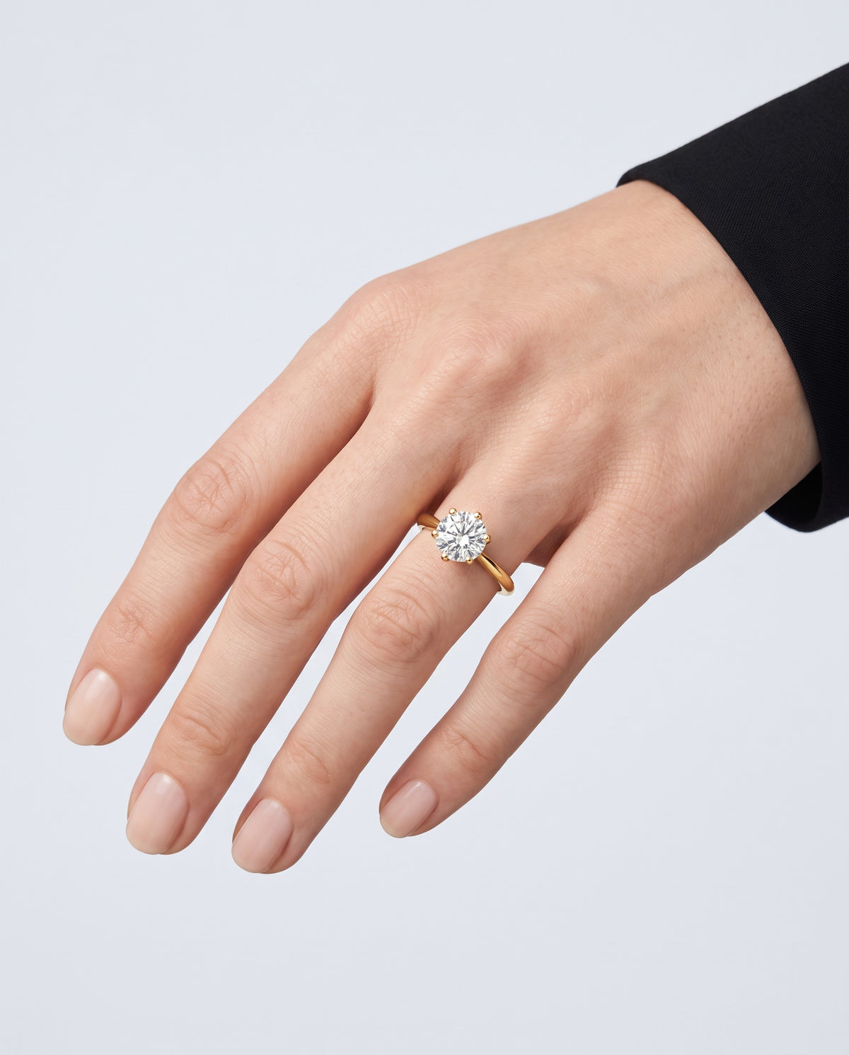 Solo Moissanite Solitaire Ring - on model