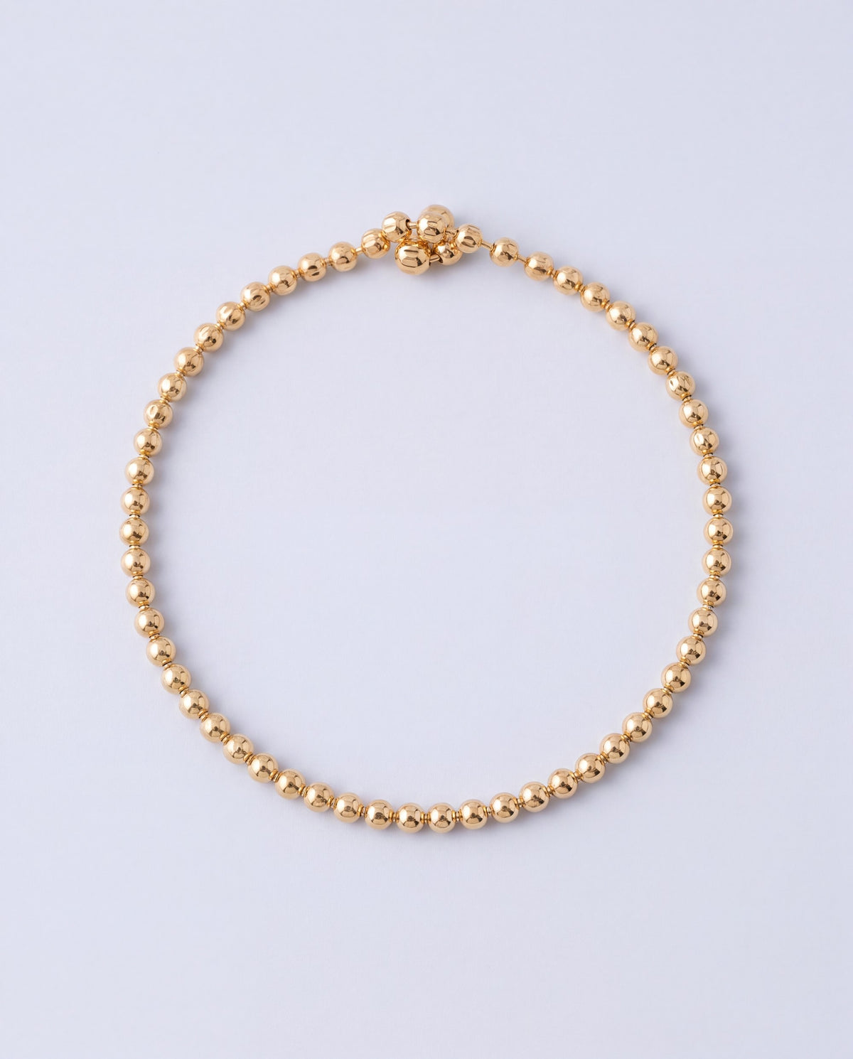Strand beaded chain bracelet in gold – front view