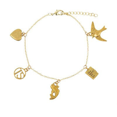 A gold chain bracelet with different charms