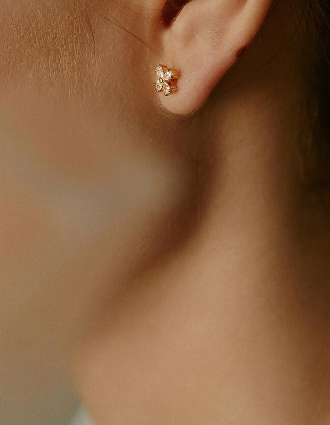 Model Wearing Clover Leaf Earrings