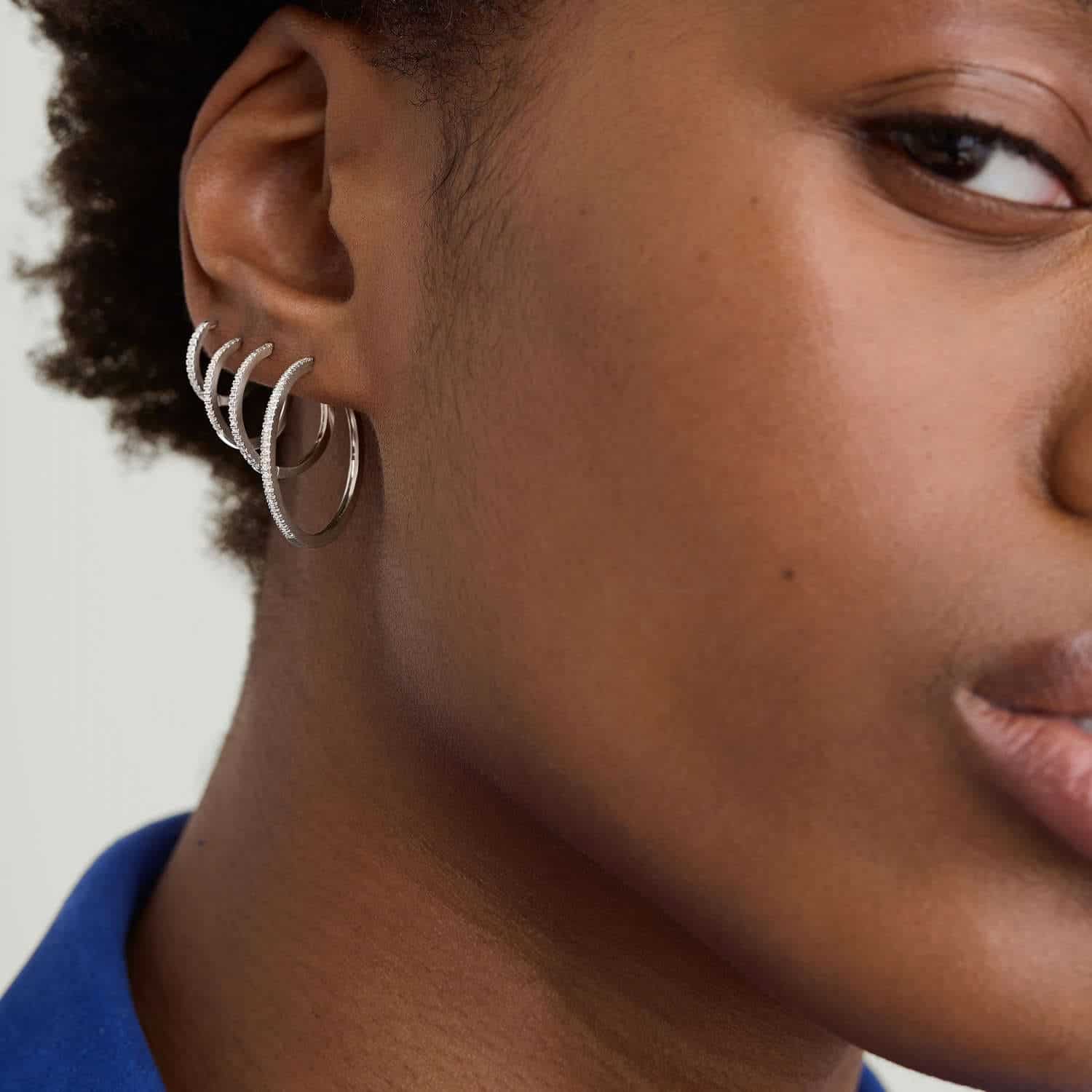 Model wearing Silver Diamond Huggie Hoop Earrings