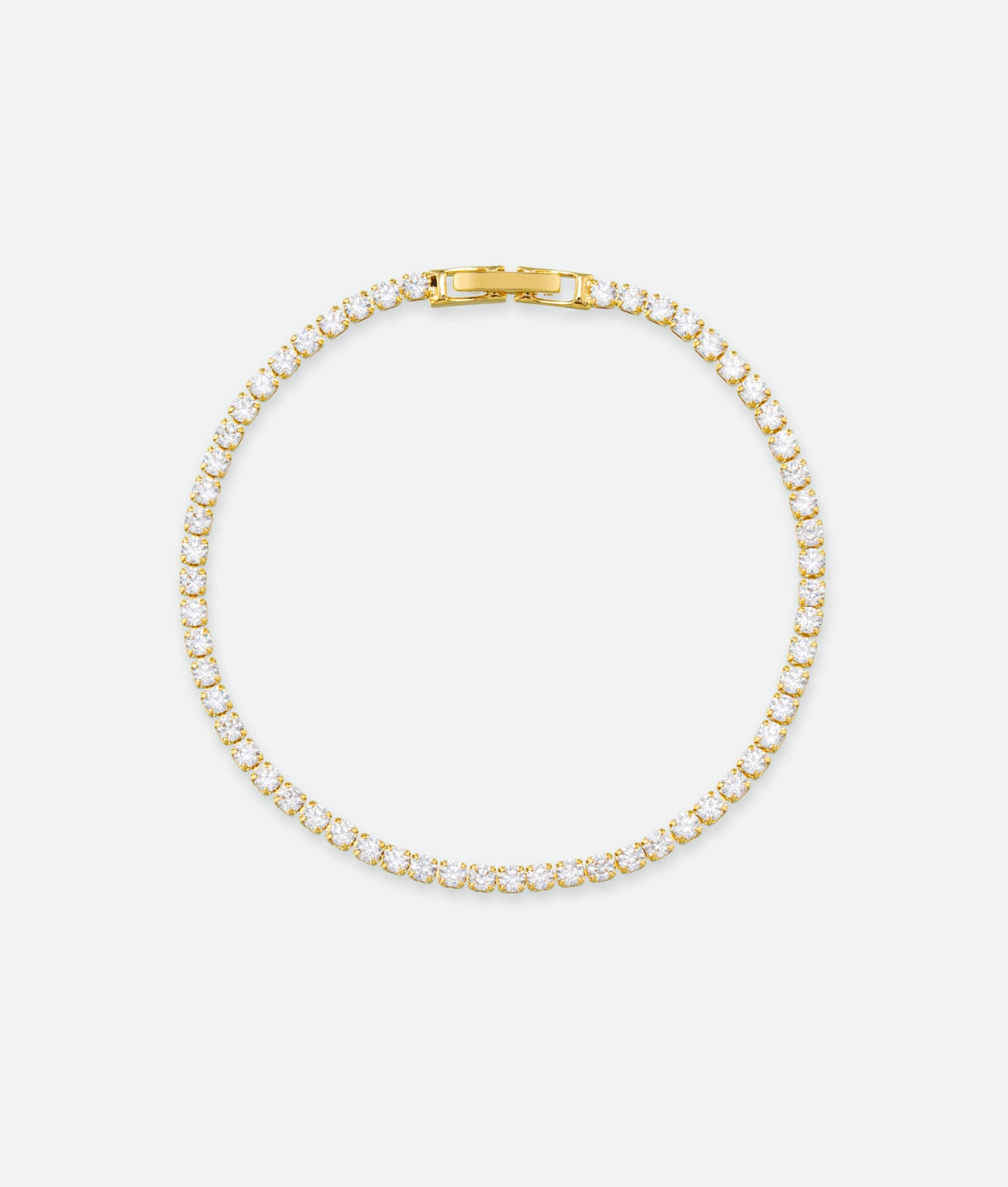 Gold bracelet on a white background