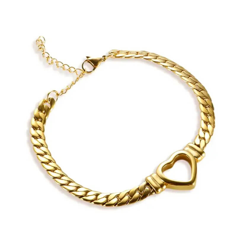 Gold chain bracelet with a heart-shaped clasp on a white background