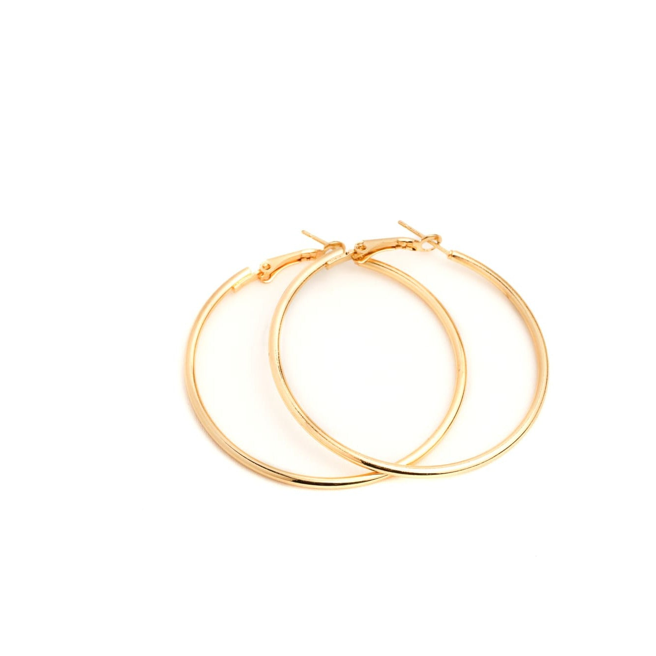 Gold hoop earrings on a white background