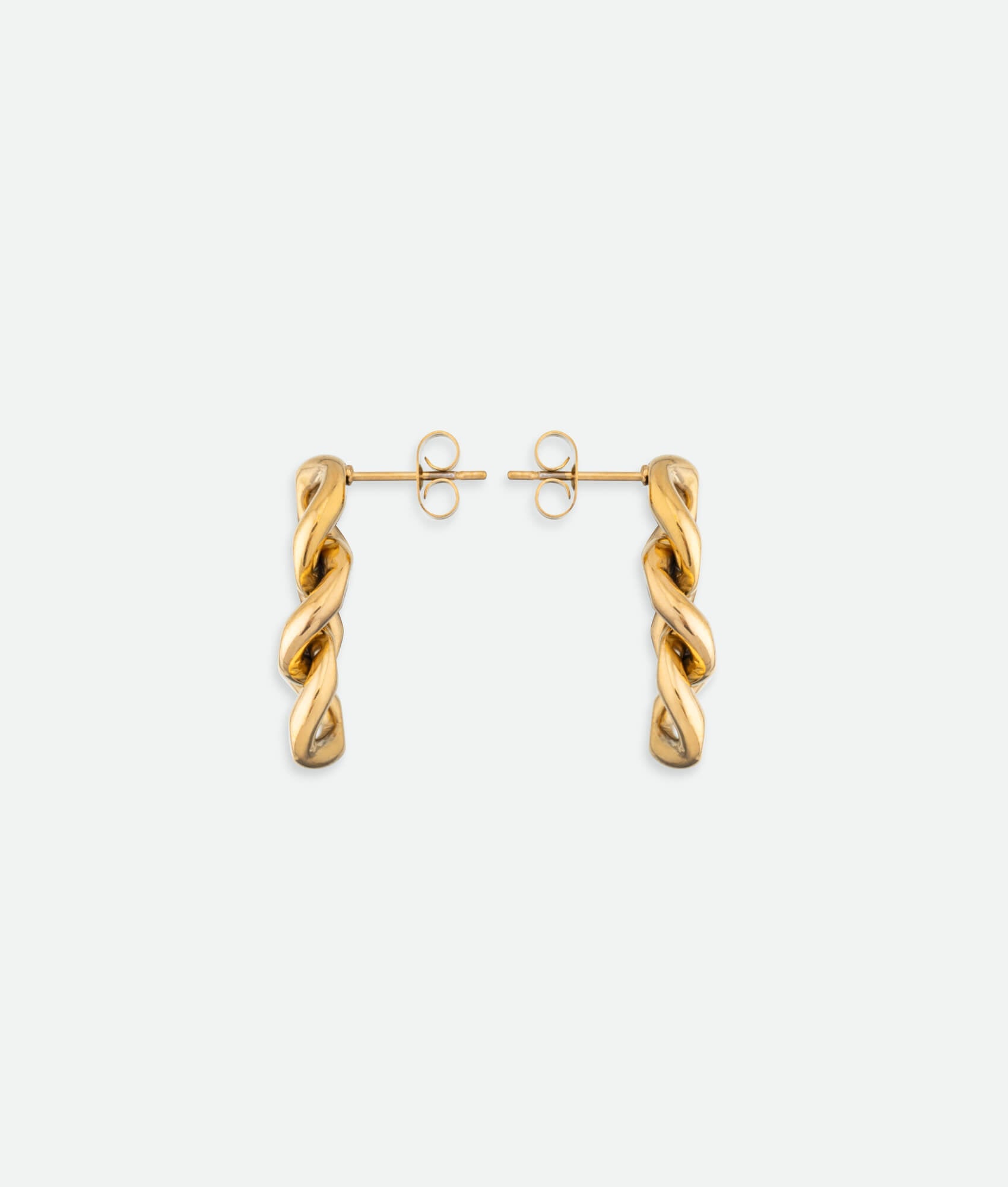 Gold hoop earrings on a white background