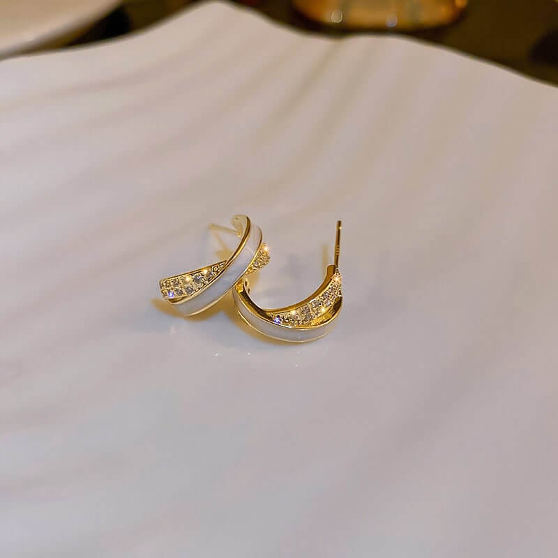 Gold Curved Cross Earrings