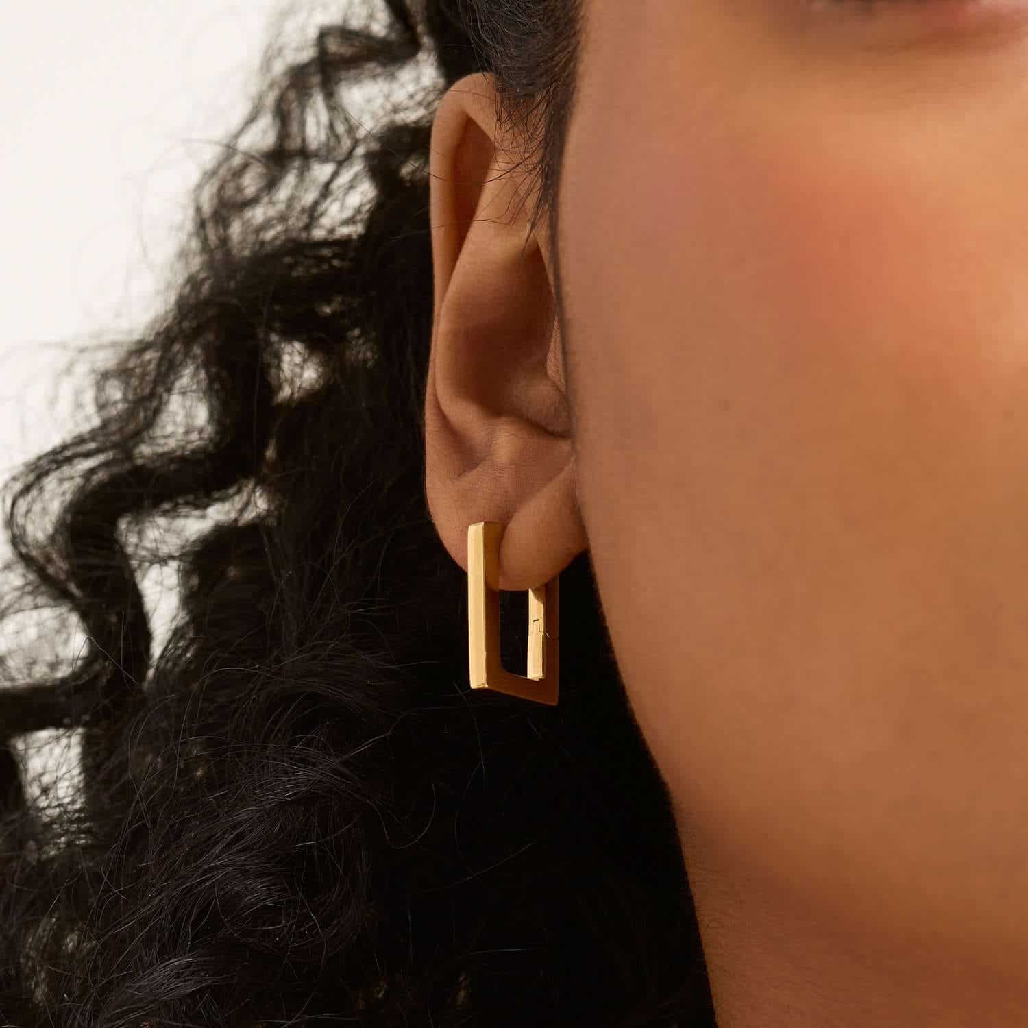 Model wearing Large Block Hoops  Gold