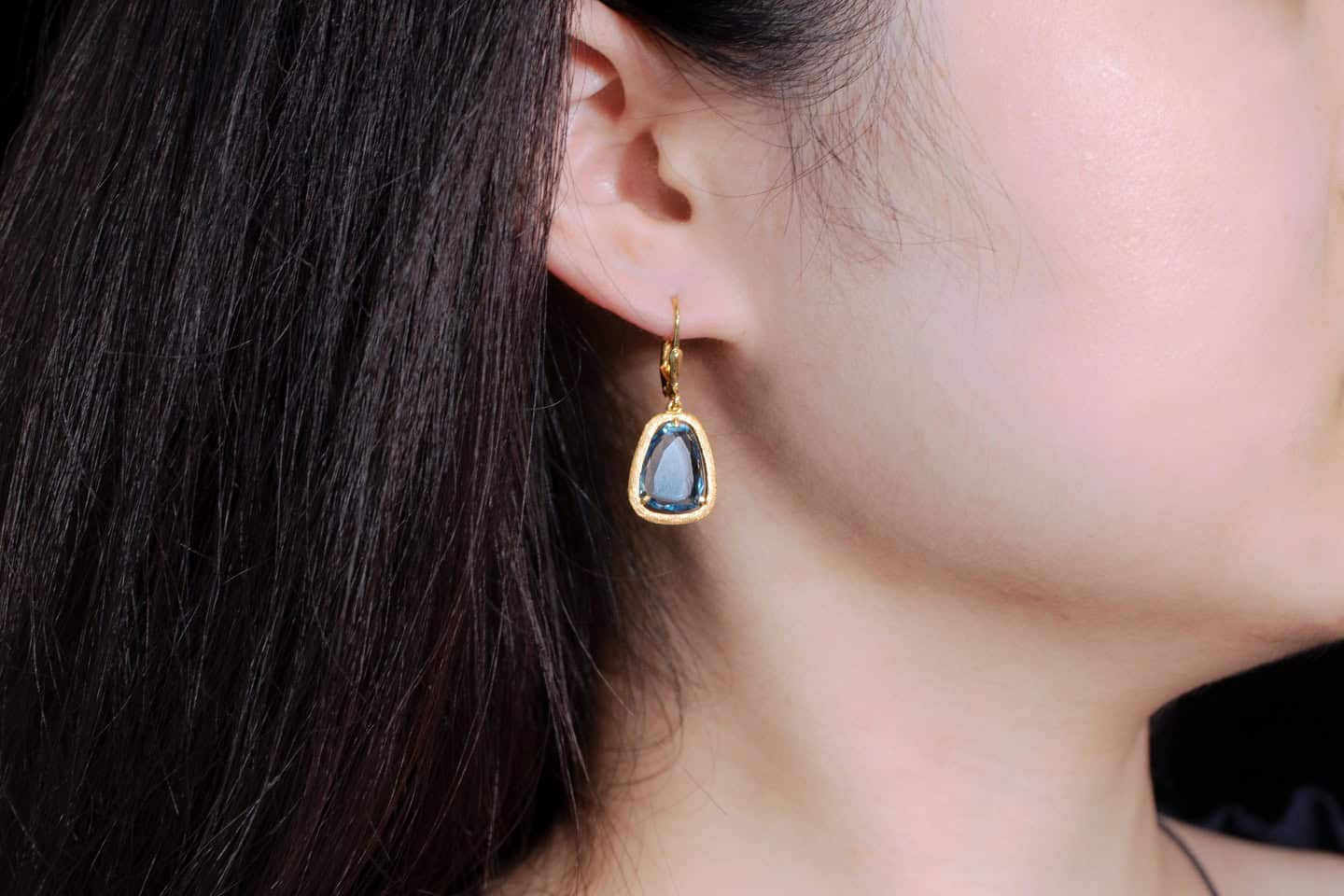 Model wearing Gold Plated Sapphire Drop Earrings