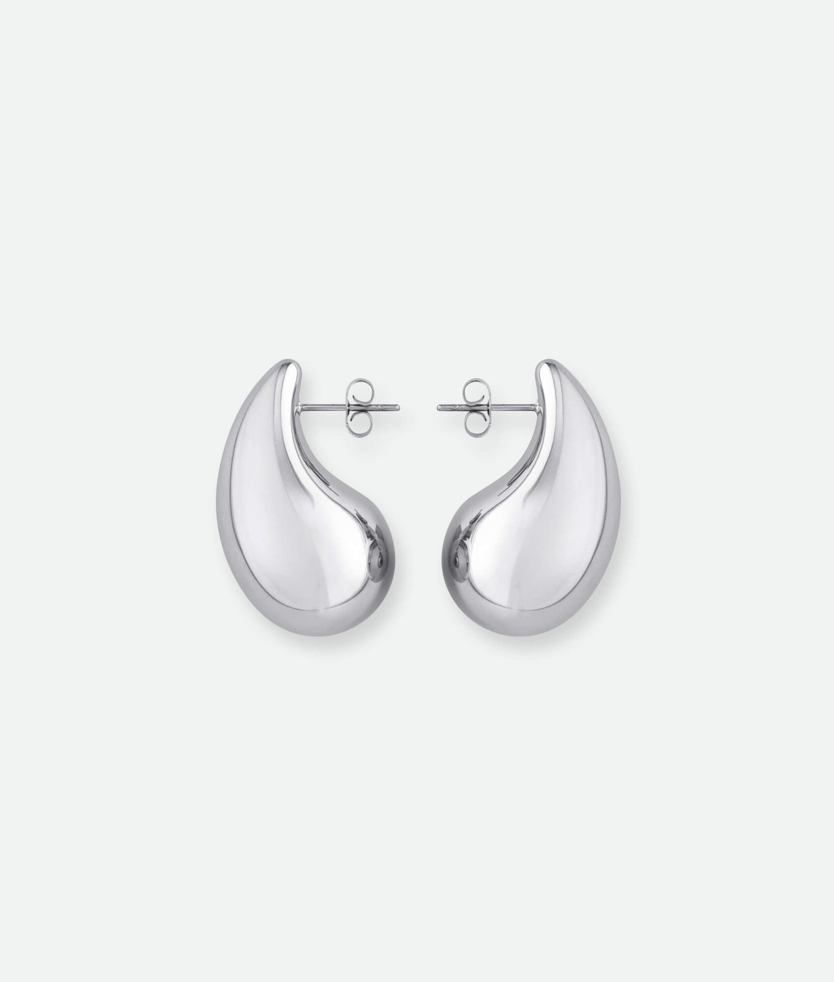 Pair of silver earrings on a white background