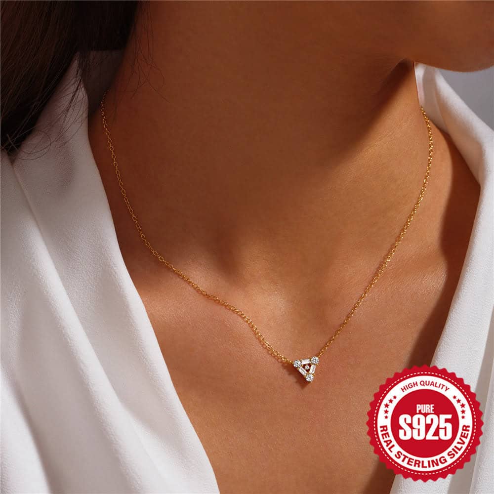 Model wearing Triangle pendant necklace gold