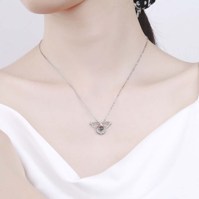 Model wearing Angel Wings Necklace 