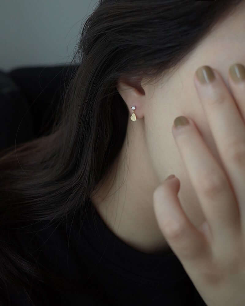 Model wearing gold Zircon Heart Stud Earrings