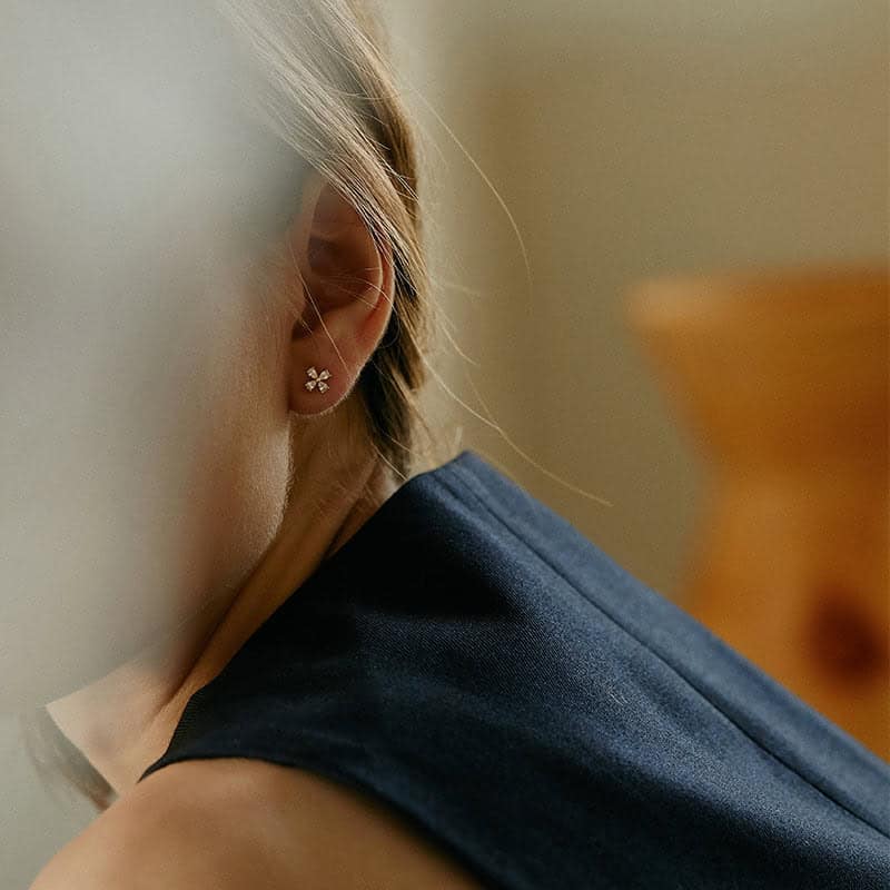 Model Wearing Clover Leaf Earrings