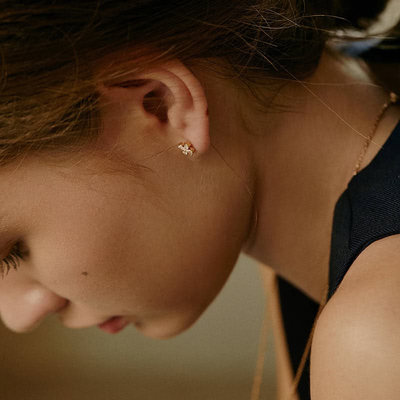 Model Wearing Clover Leaf Earrings