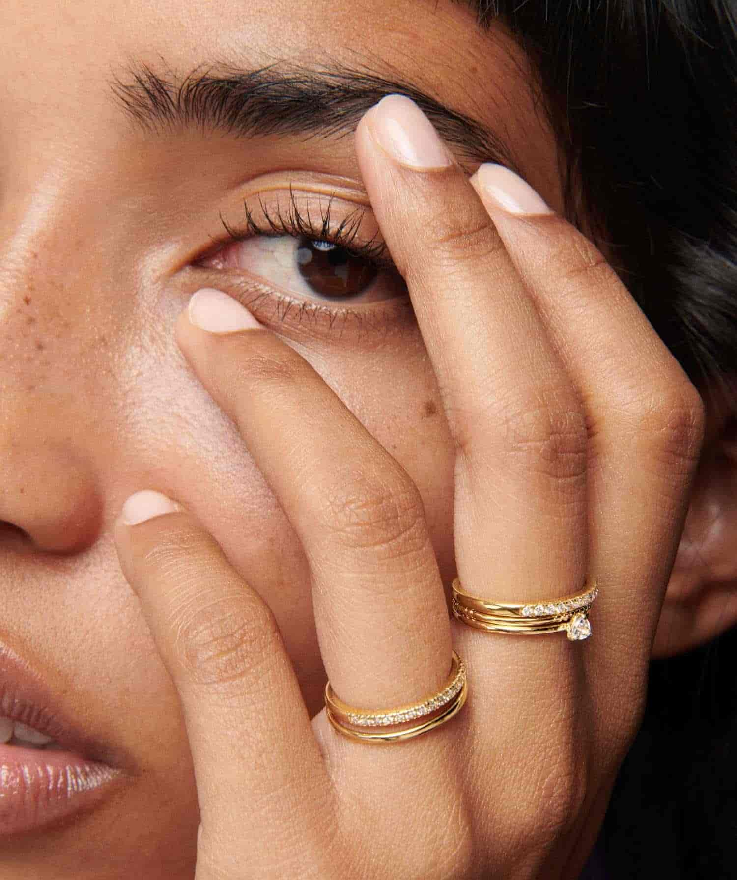 Model wearing Gold Tennis ring  Stacks