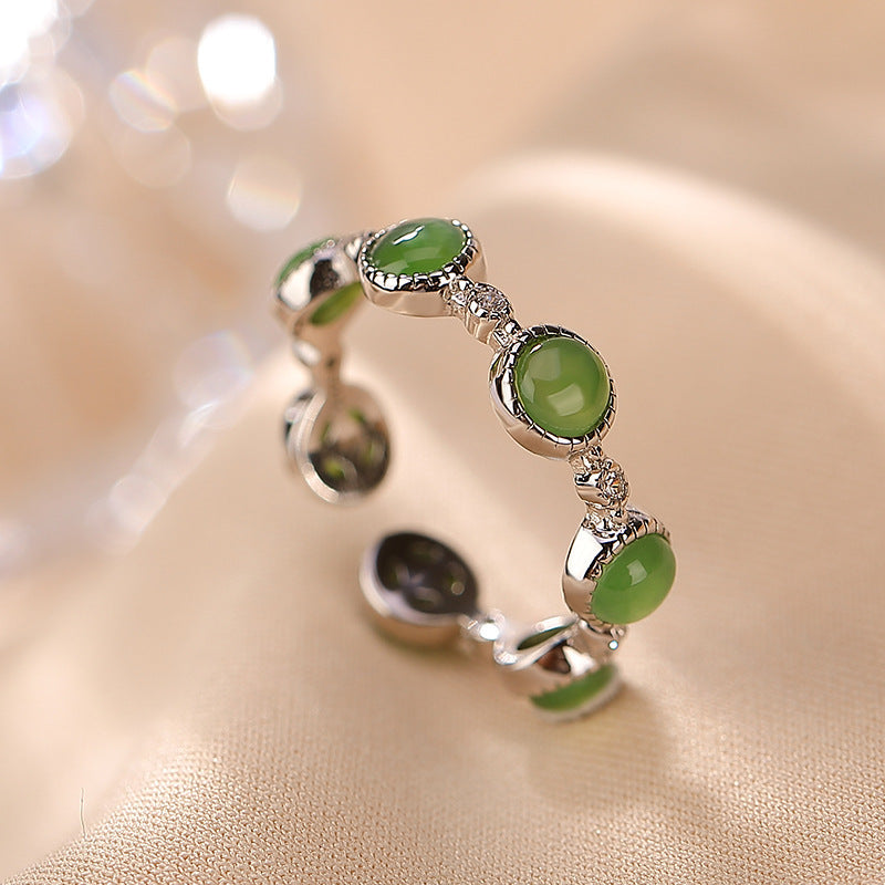 Green Seven Stone Ring