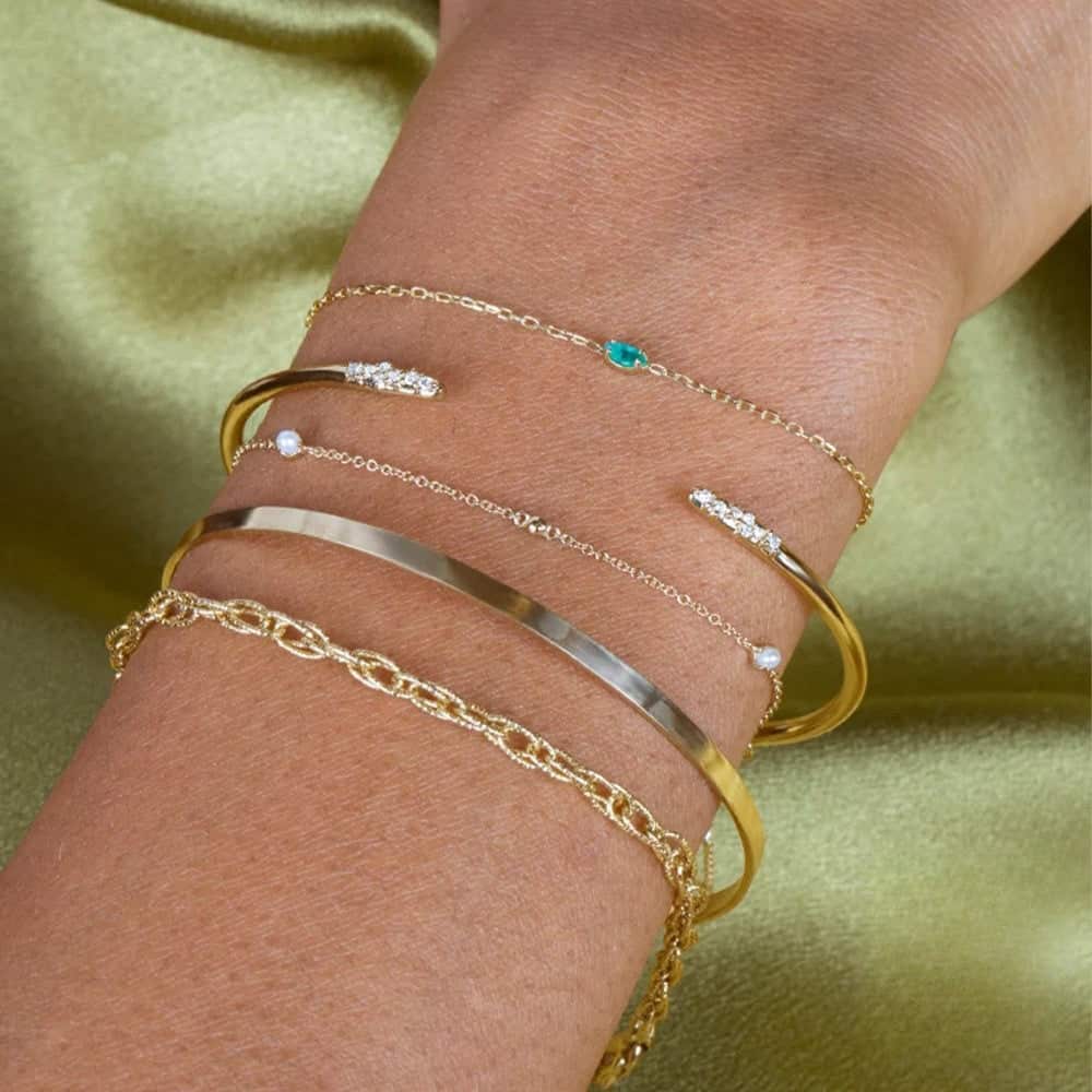 Model wearing bracelet stacks