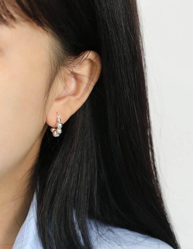 Model wearing Geometric Silver Bead Earrings