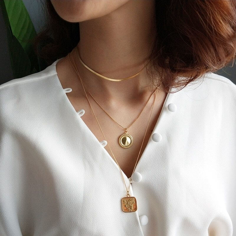 Woman wearing vintage chain necklaces