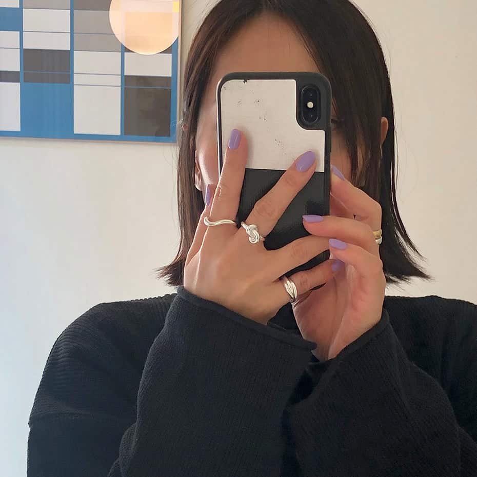 Girl wearing rings taking a selfie