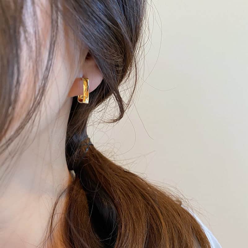 Girl wearing Geometric Gold Hoop Earrings