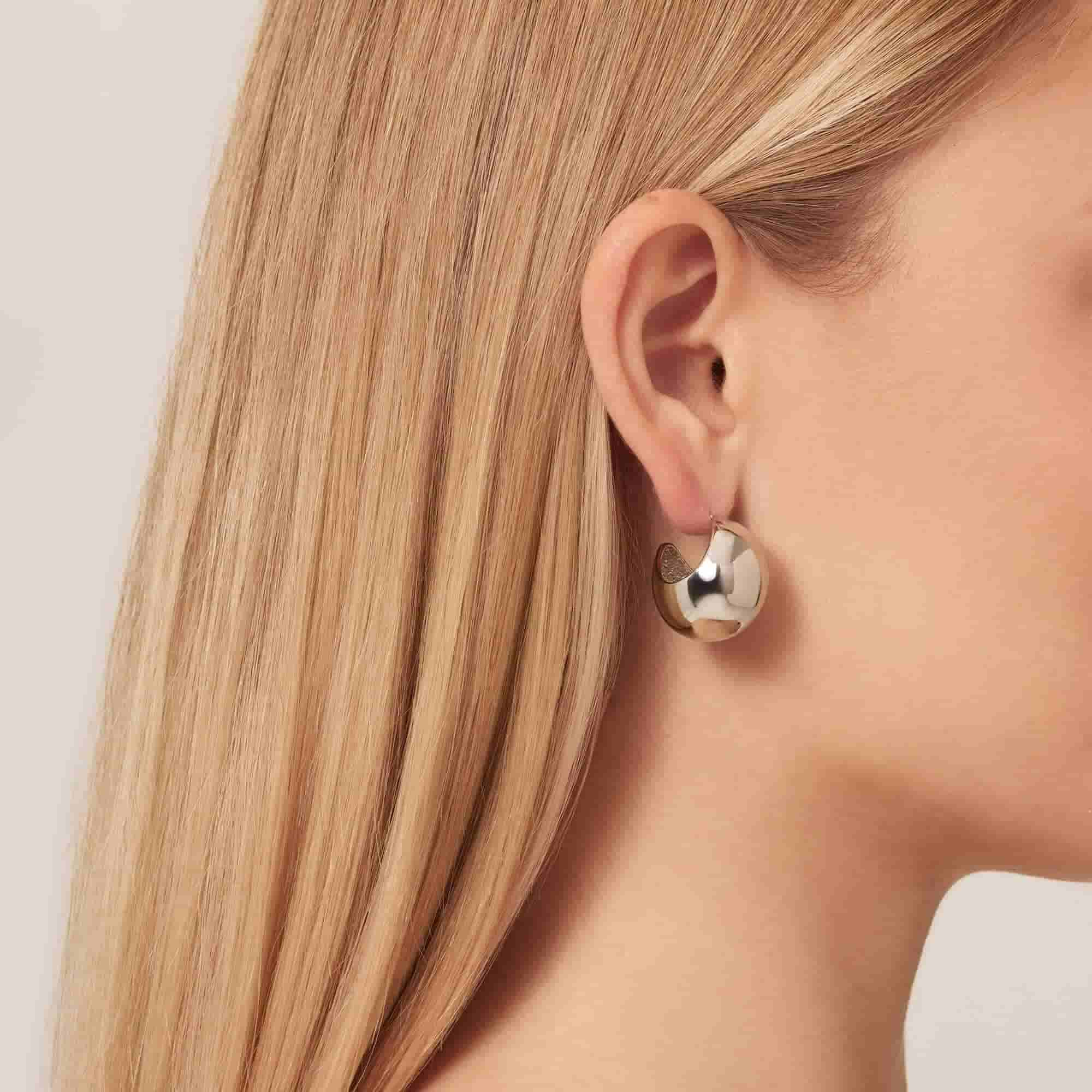 Model wearing Silver C Drop Hoop Earrings 