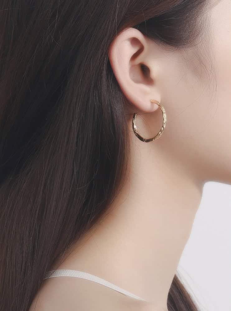 Model wearing Hammered Foil Gold Hoop Earrings