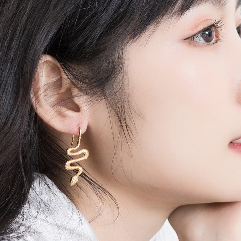 Model wearing Gold Snake Earrings