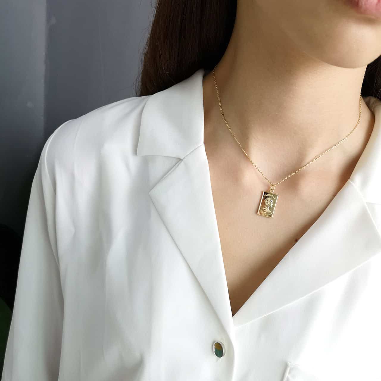 Woman wearing Engraved Empress Pendant Necklace Gold