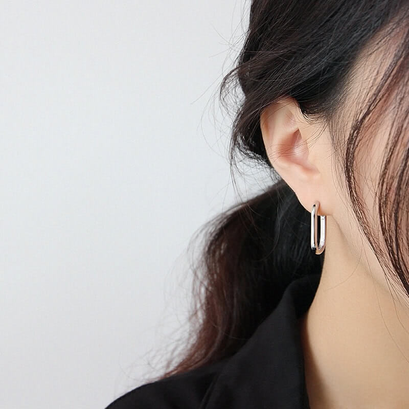 Model wearing silver Rectangle Hoop Earrings