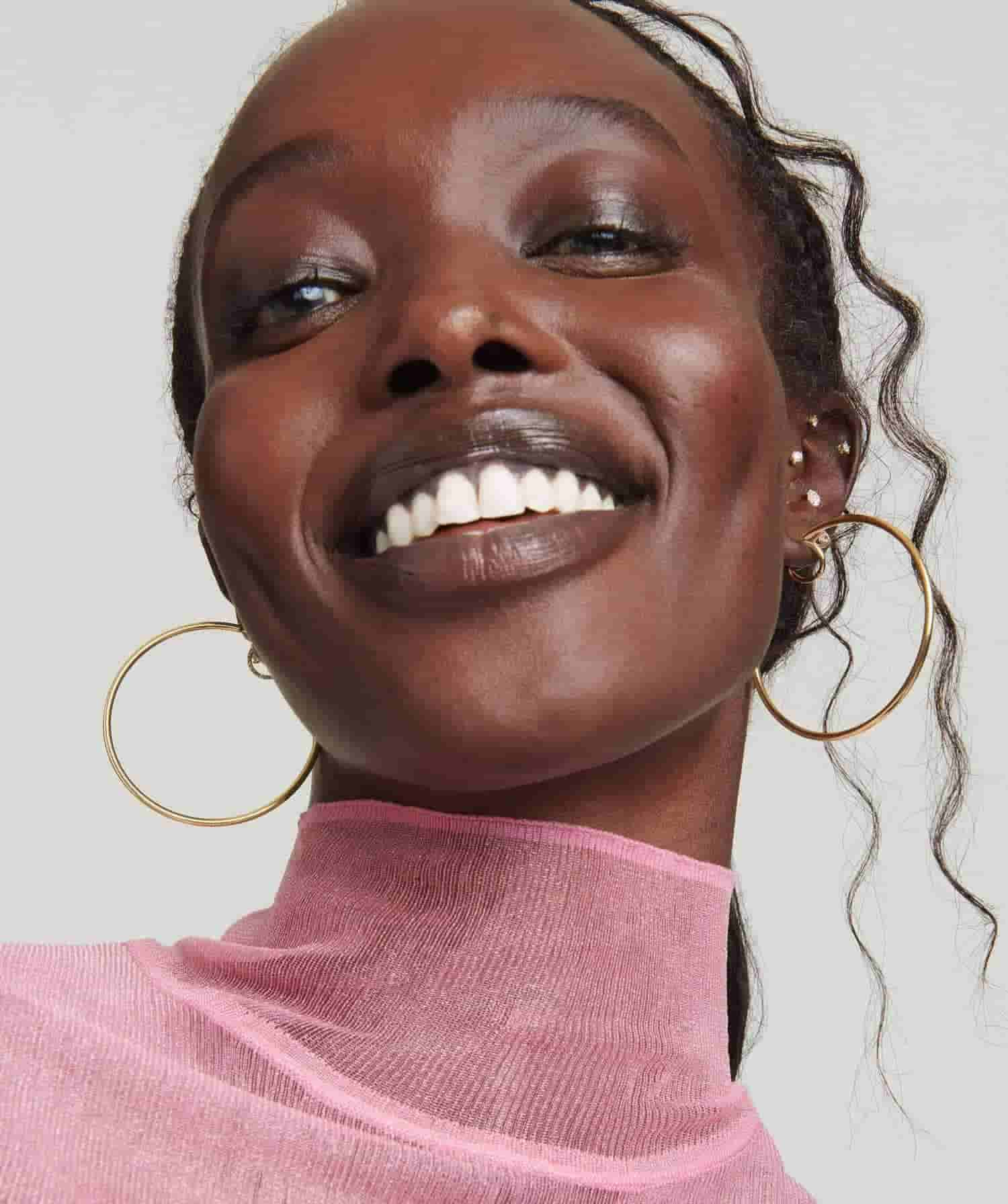 Model wearing Gold Oversized Hoop Earrings