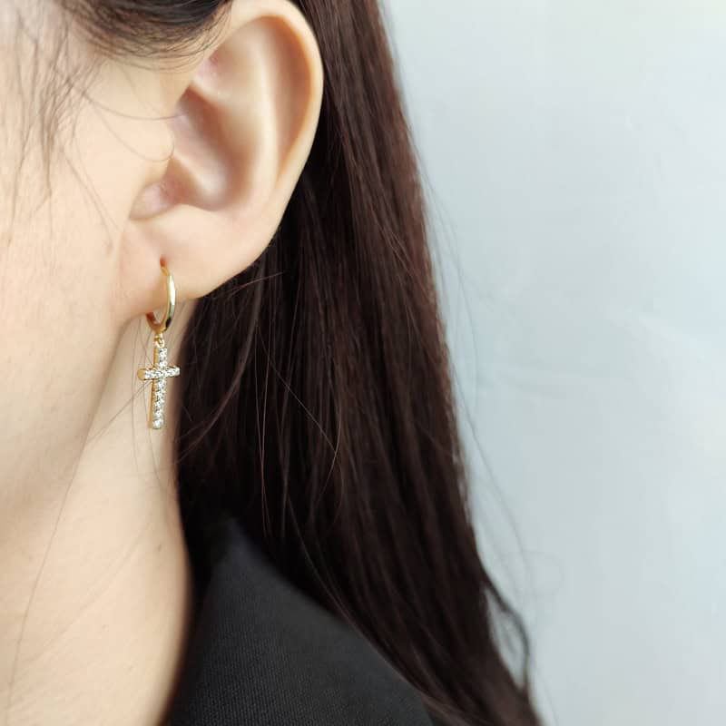 a woman wearing Sterling Silver Earrings