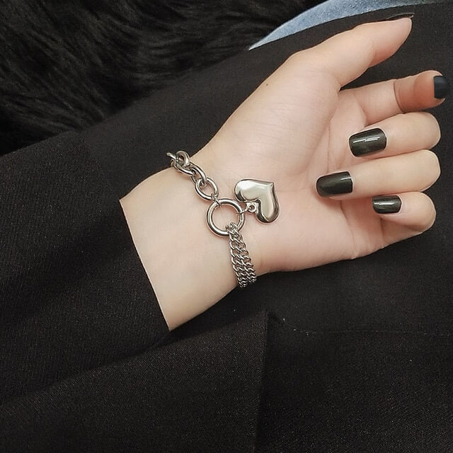 A Women wearing Silver Love Heart Bracelet