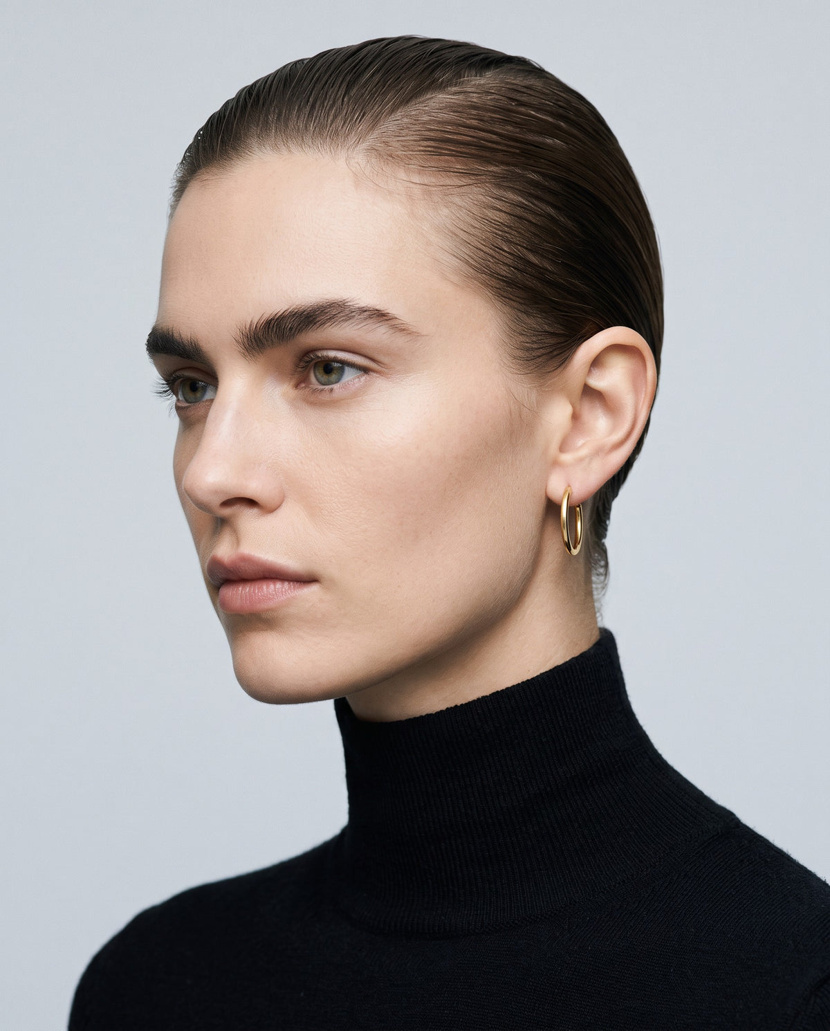 Buckle Huggie Earrings – editorial campaign image