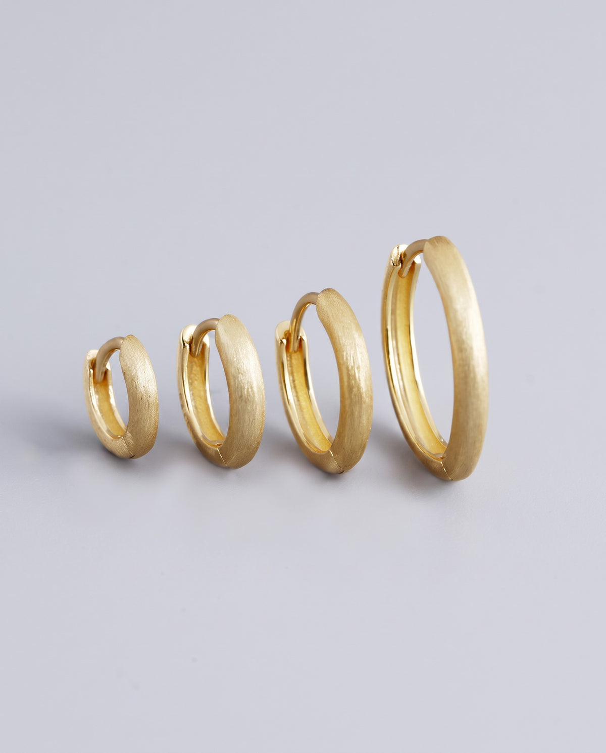 Pebble Round Huggie Earrings - angle