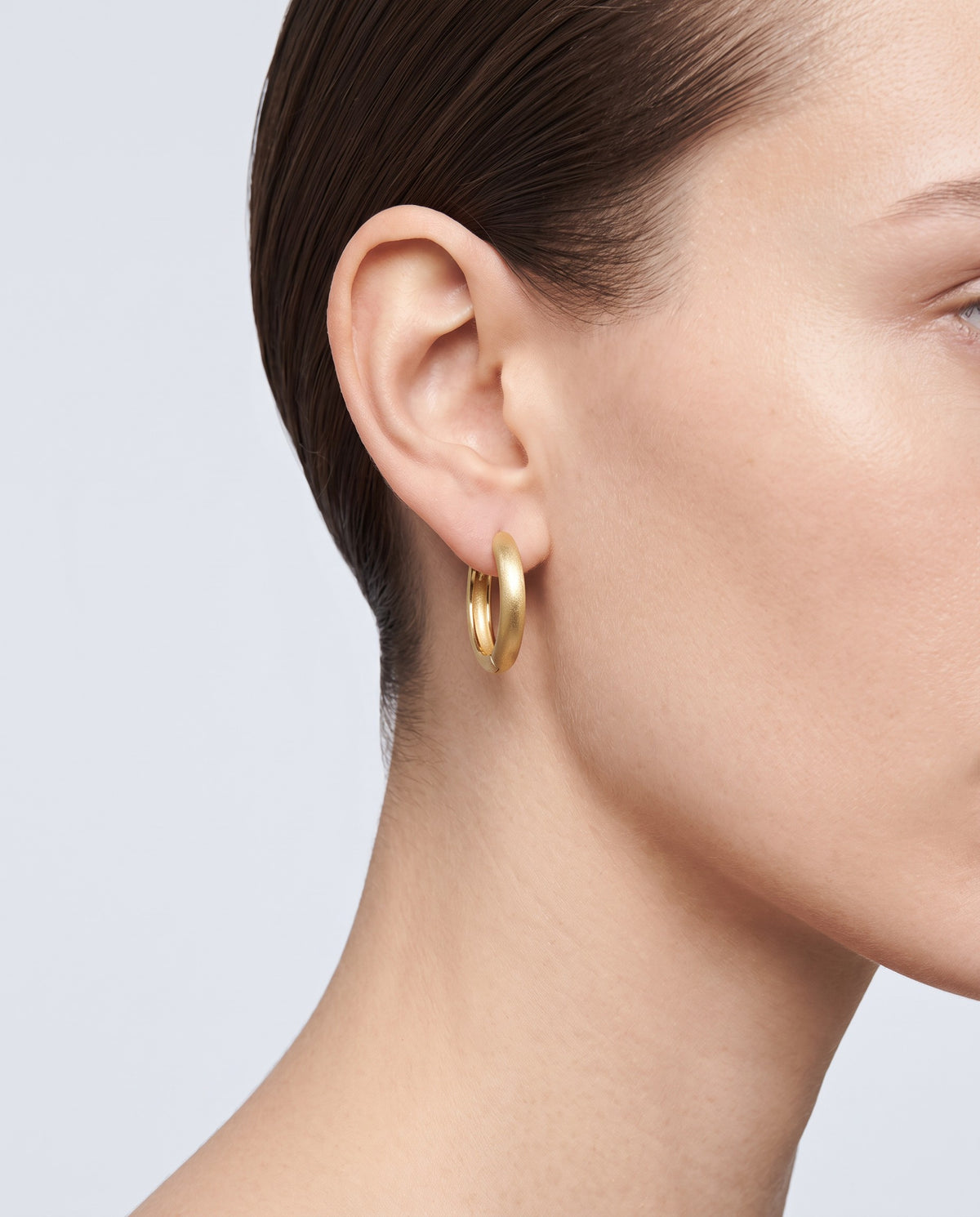 Pebble Round Huggie Earrings - on model
