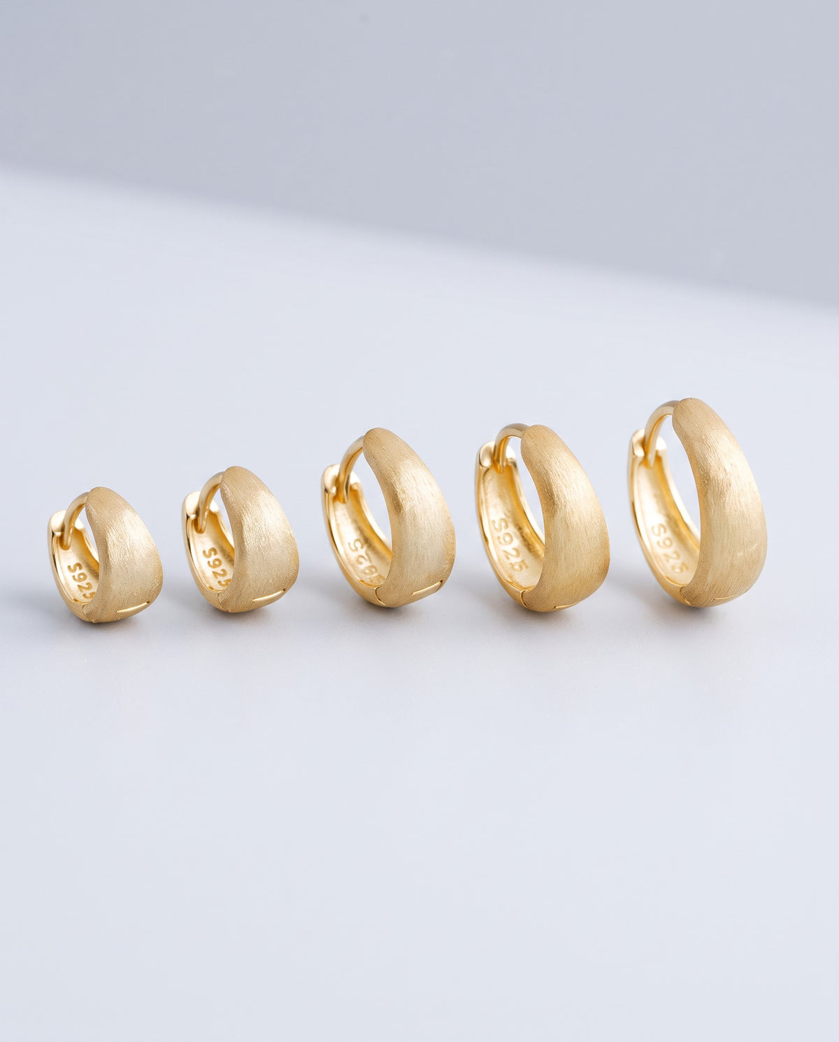 Sleek Wide Huggie Earrings - angle