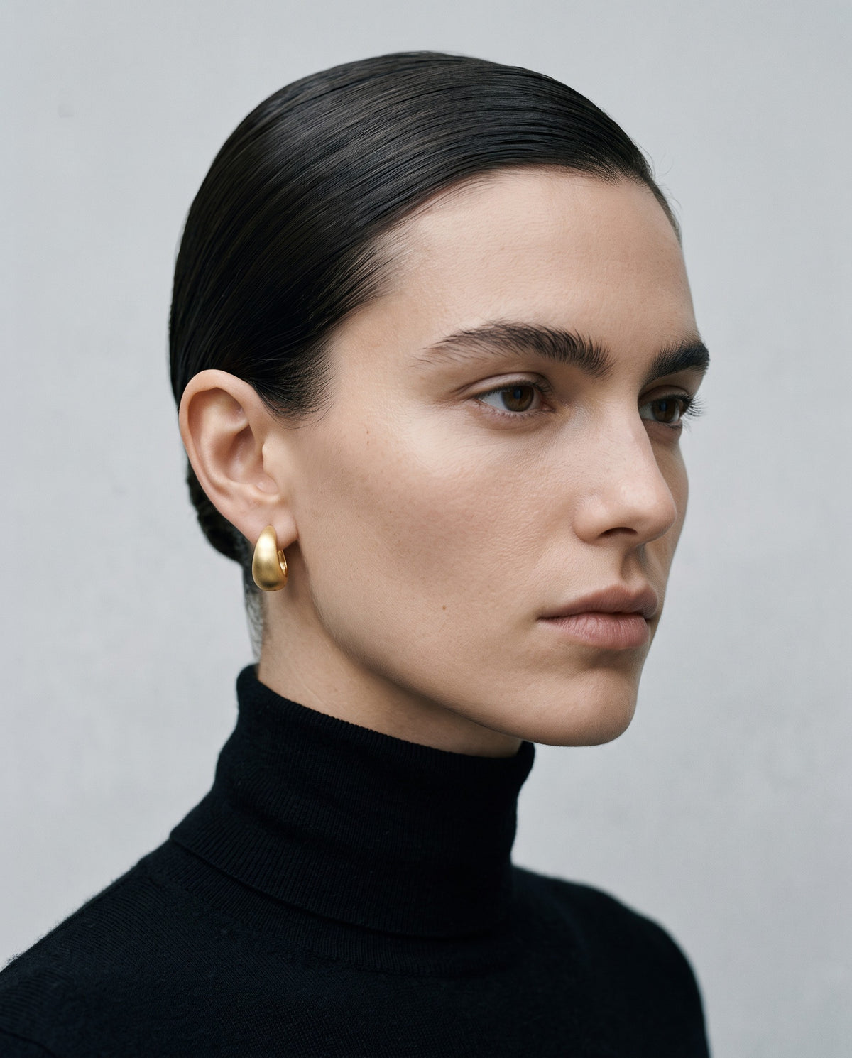 Sleek Wide Huggie Earrings – editorial campaign image