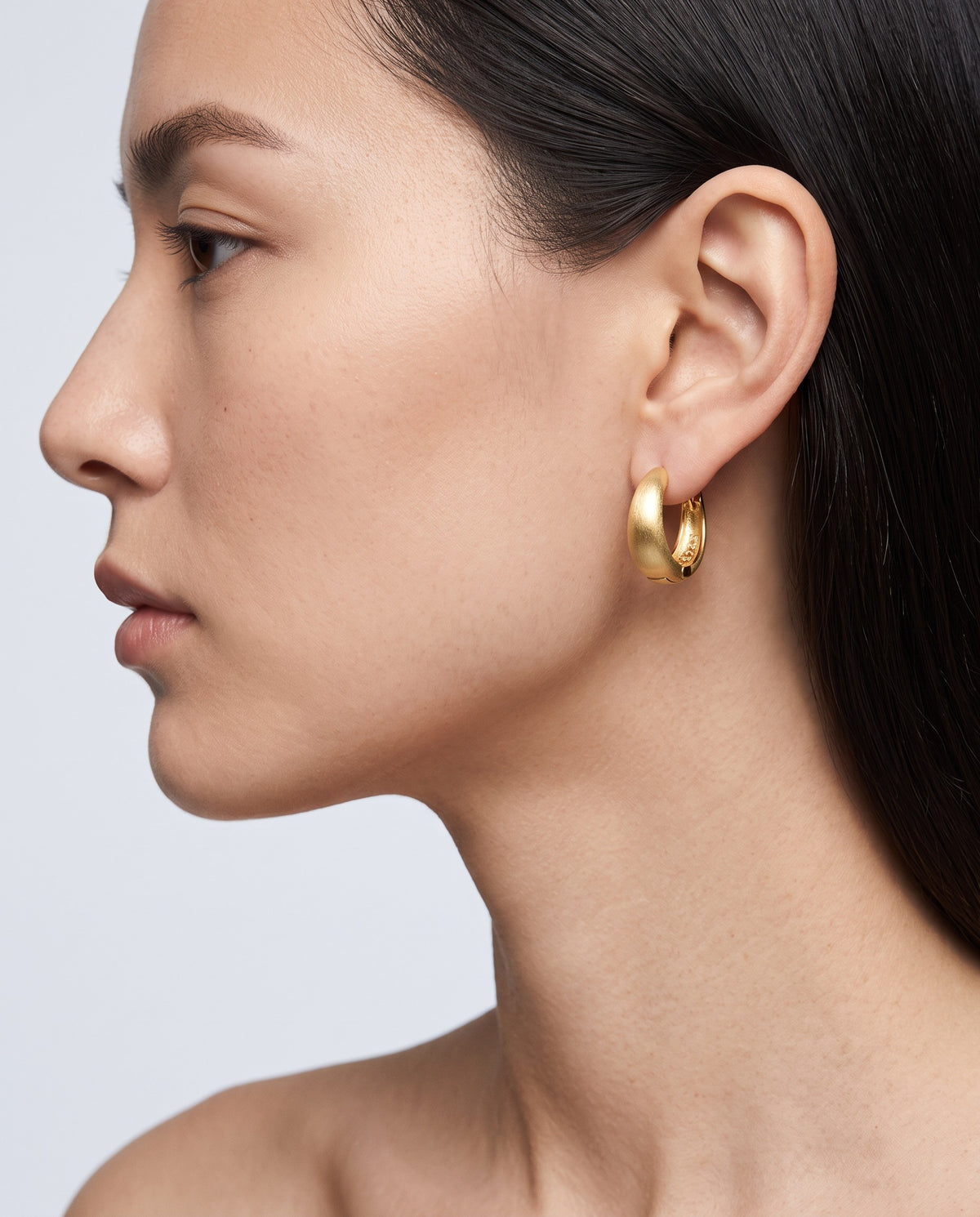 Sleek Wide Huggie Earrings - on model