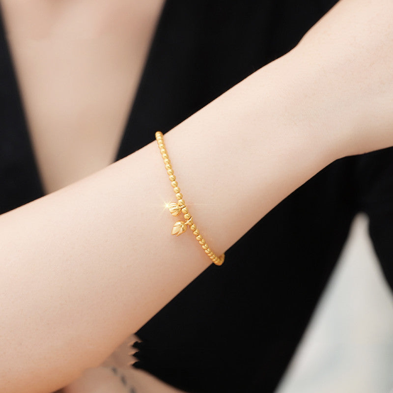 A Woman wearing Women's Plain Chain Gold Bead Bracelet