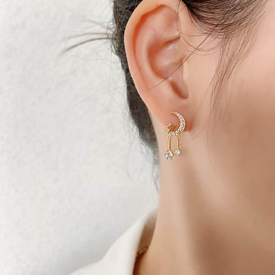 A Woman wearing Zircon Star And Moon  Earrings